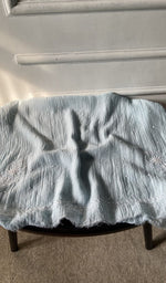 Bottom fabric draped over the stool
