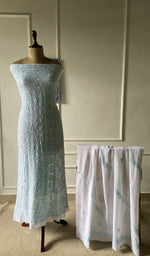 The set on the mannequin with its dupatta beside it