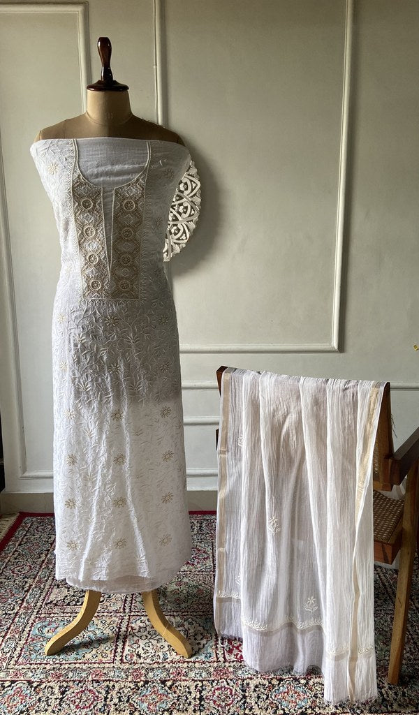 White pure maheshwari mul chanderi chikankari 2 pc unstitched suit set laid out