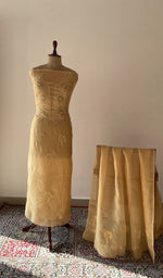 The set on the mannequin with its dupatta beside it