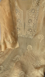 Motifs across the body of the beige kurta