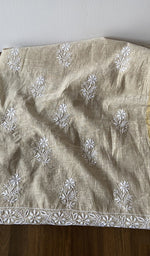 The kurta piece folded on the carpet