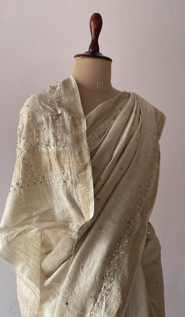 Beige pure silk saree draped on the mannequin