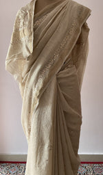 Border along the edge, allover badla work on border pallu and body