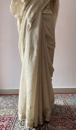 Allover badla work on border pallu and body across the pallu