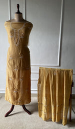 The set on the mannequin with its dupatta beside it