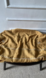 Bottom fabric draped over the stool