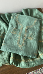Green pure mul chanderi kurta piece folded, fine chikankari with anar motifs and haath ki jaali