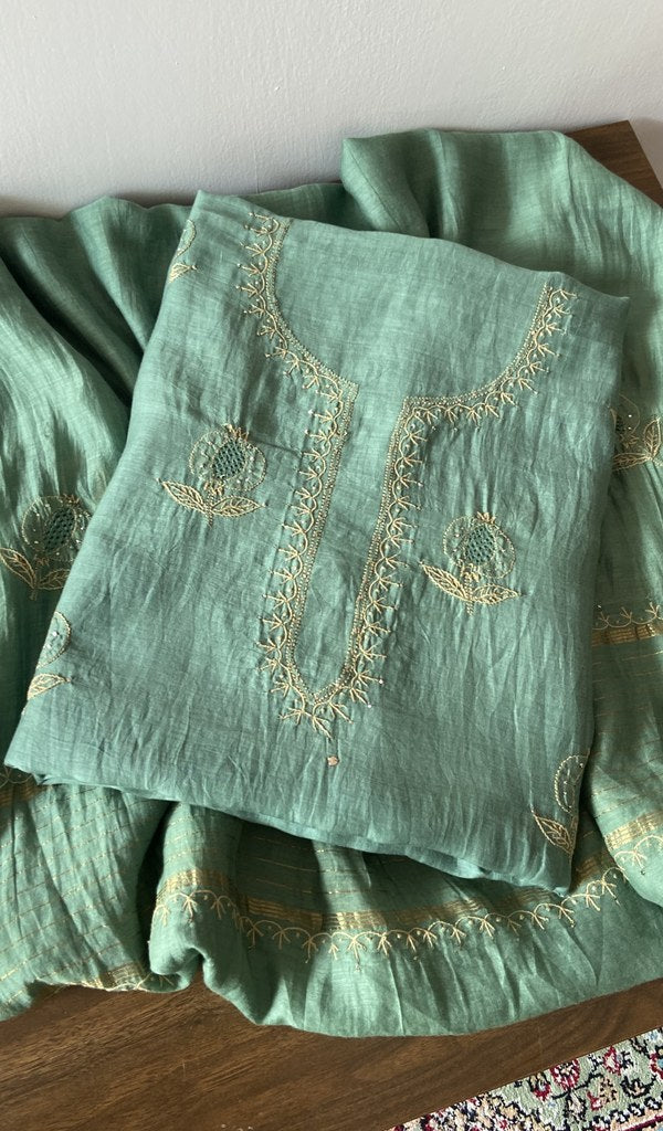 Green pure mul chanderi kurta piece folded, fine chikankari with anar motifs and haath ki jaali