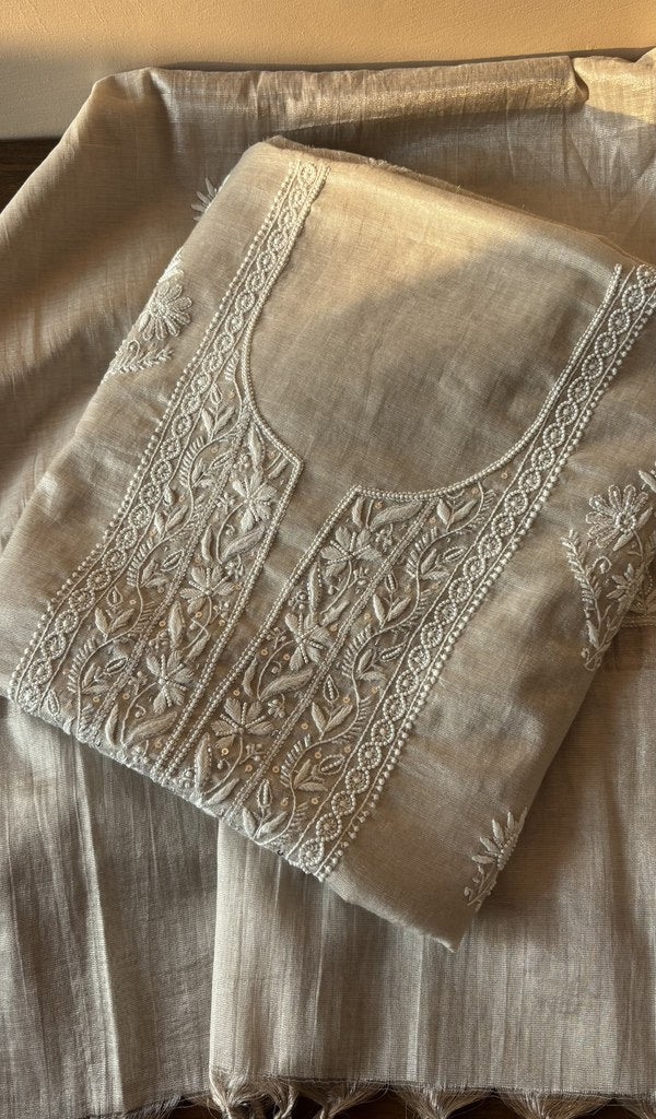 Folded beige tissue chanderi kurta, front view