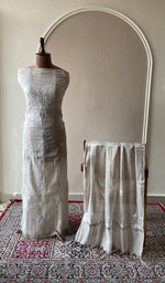 Beige tissue chanderi set on the mannequin with its dupatta