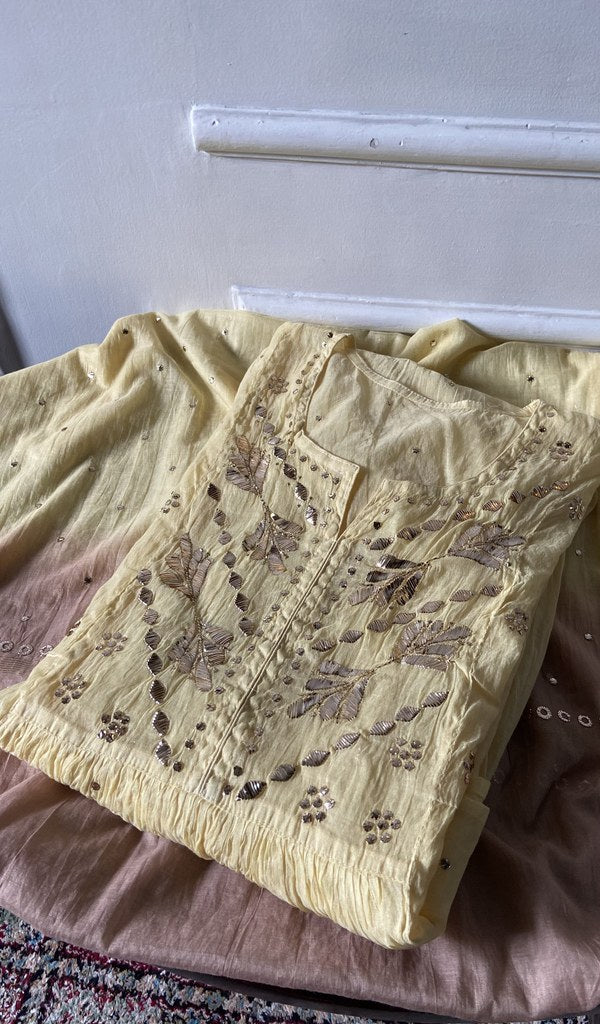 Pale Yellow pure mul chanderi kurta piece folded, fine chikankari in view