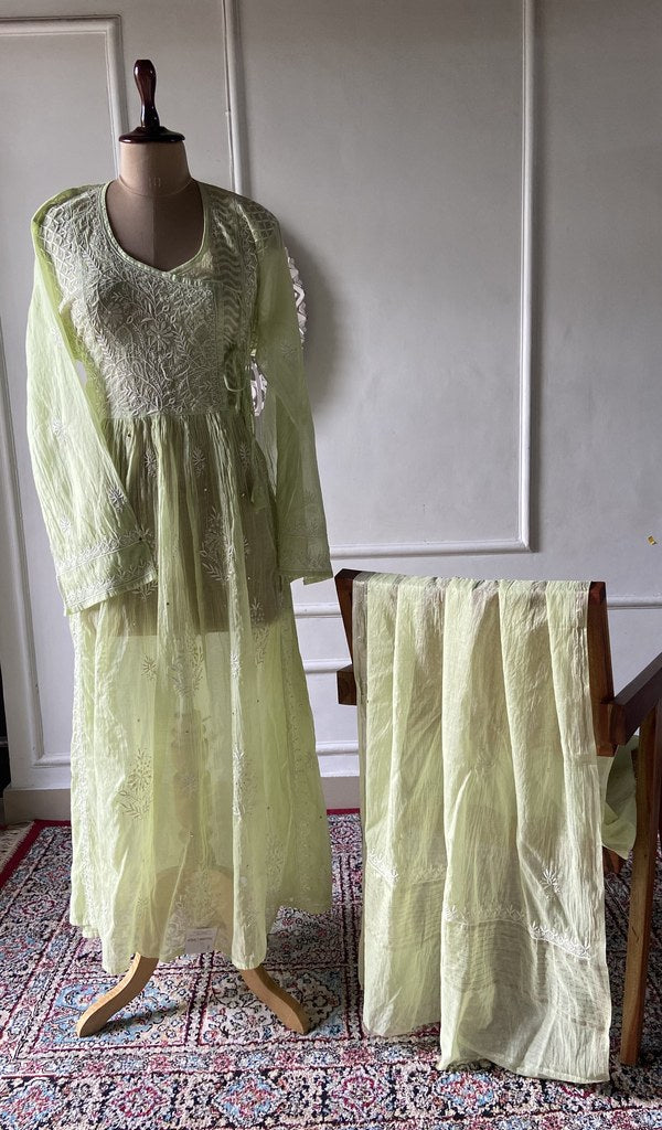 Lime green pure mul chanderi chikankari 3 pc semi-stitched suit set laid out