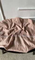 Bottom fabric draped over the stool