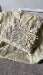 border and hem of the grey kurta piece