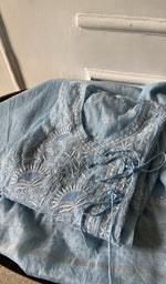 blue pure mul chanderi chikankari suit set, folded