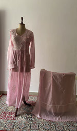 The set on the mannequin with its dupatta beside it