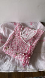 Folded white pure mul chanderi kurta piece with chikankari on the panel