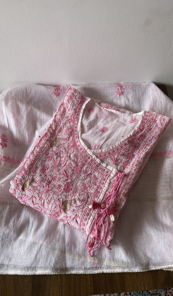 Folded white pure mul chanderi kurta piece with chikankari on the panel