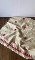 The kurta piece folded on the carpet