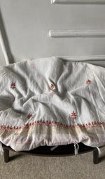 Bottom fabric draped over the stool