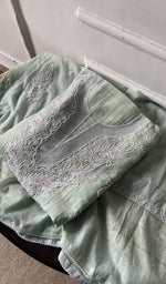 Green pure mul chanderi kurta piece folded, fine chikankari