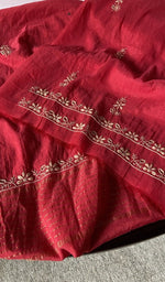 border and hem of the red kurta piece