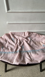 Bottom fabric draped over the stool