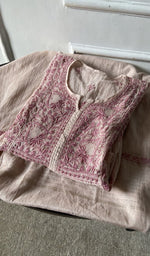 border and hem of the pink kurta piece
