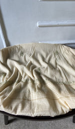 Bottom fabric draped over the stool