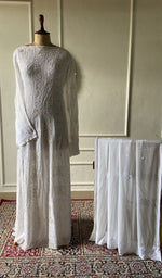 将图像加载到图库查看器中， Ivory viscose georgette chikankari 2 pc semi-stitched suit set laid out