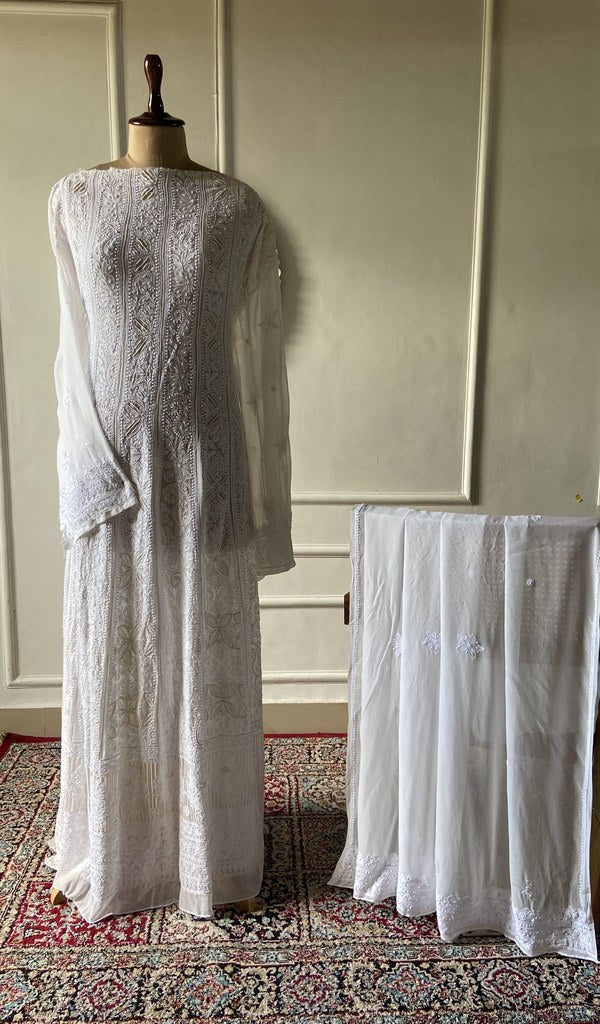 Ivory viscose georgette chikankari 2 pc semi-stitched suit set laid out