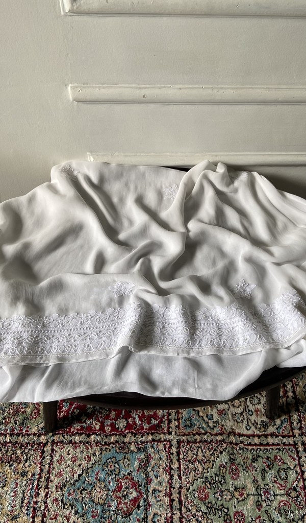 Chikankari across the body of the ivory kurta piece