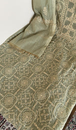 Kurta laid flat with the dupatta, do taar and teen taar jaaldar chikankari