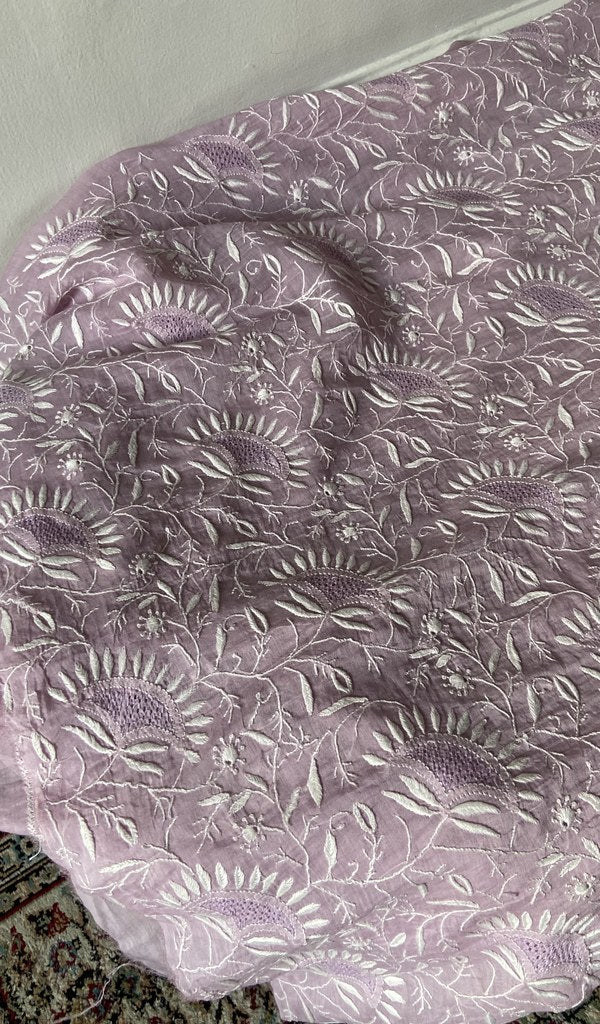 Chikankari across the body of the lilac kurta piece