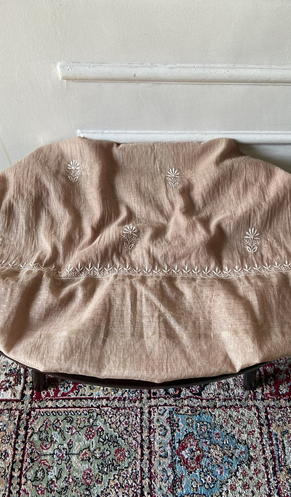 Beige pure mul chanderi chikankari 3 pc unstitched suit set laid out