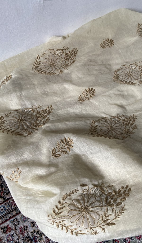 Chikankari across the body of the cream kurta piece