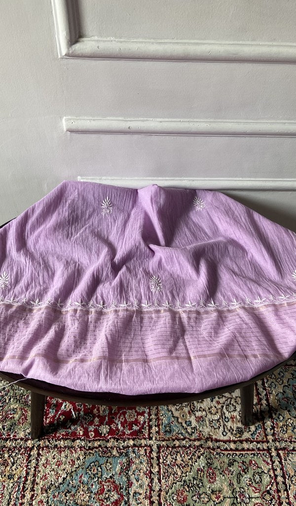 Chikankari across the body of the orchid kurta piece