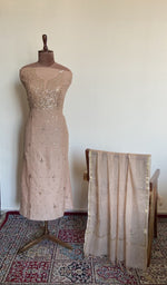 The set on the mannequin with its dupatta beside it