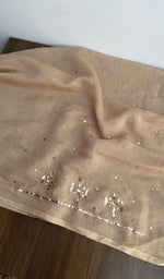 The dupatta spread out, peach mul chanderi