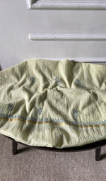 fabric laid out, off white pure mul chanderi