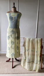 off white pure mul chanderi chikankari set on the mannequin with the dupatta