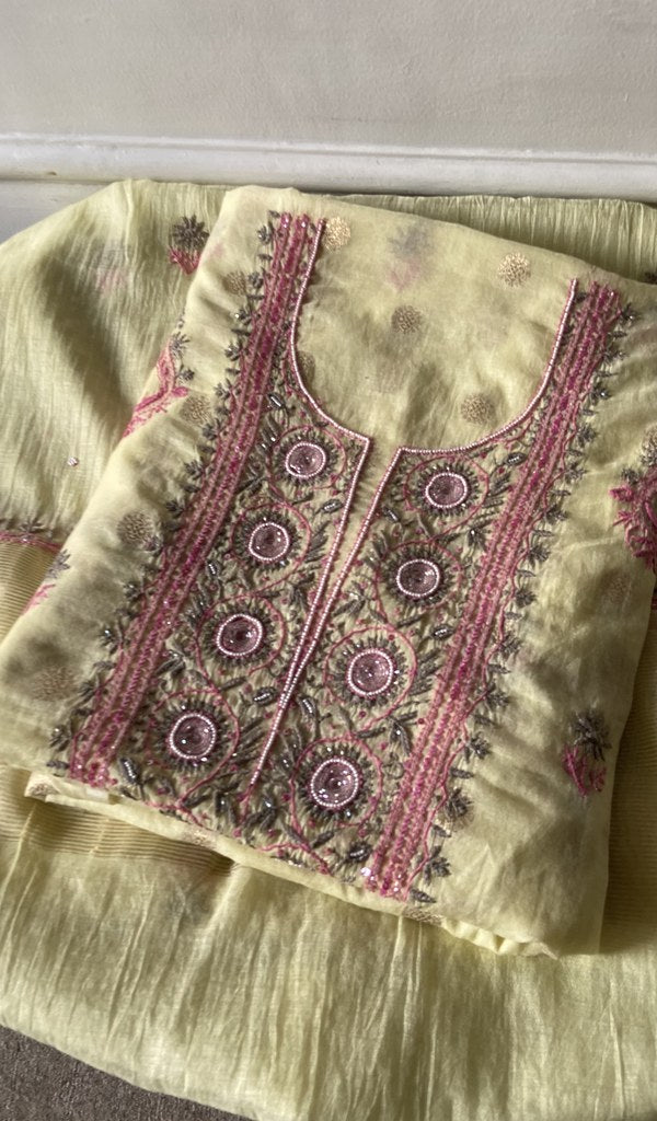 yellow pure mul chanderi kurta piece folded, fine contrast chikankari with beads cutdana and sequins on n