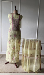 The set on the mannequin with its dupatta beside it