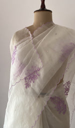 border and edging on the off white pure organza silk saree