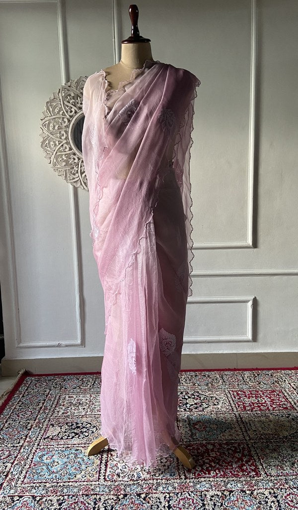 Pink pure organza silk chikankari saree laid out