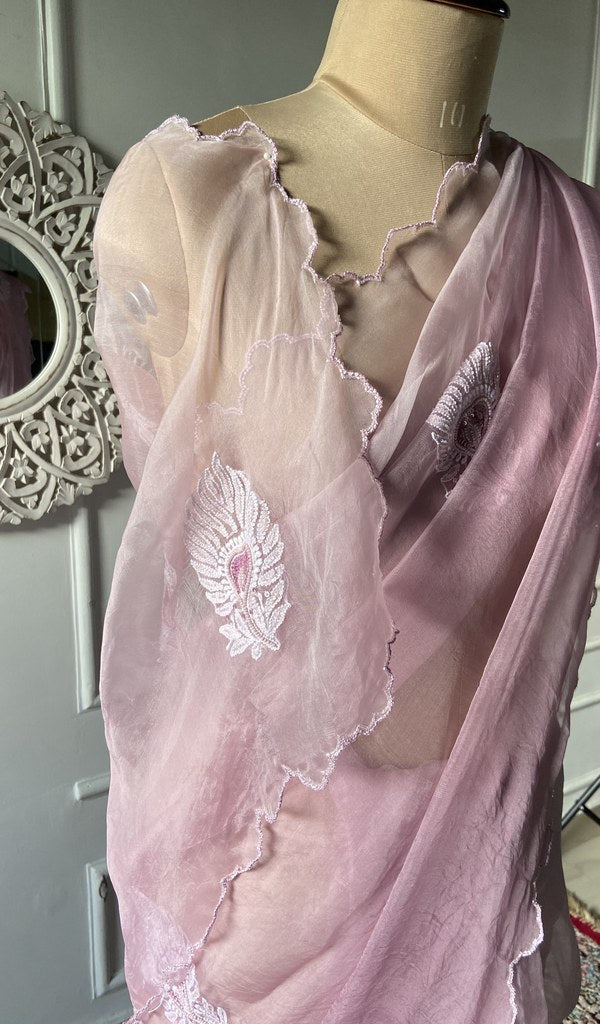Chikankari across the body of the pink kurta piece