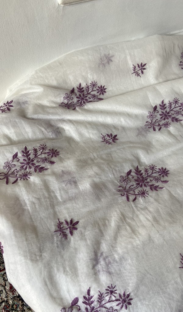 Chikankari across the body of the white kurta piece