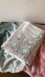 White cotton kurta piece folded, fine contrast jaaldar chikankari