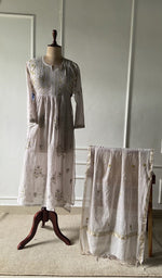 The set on the mannequin with its dupatta beside it